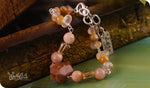 Load image into Gallery viewer, bhavaa Premium Gemstone Jewelry- Bracelet. Vivacious Charm Collection, Mark-1 | Gemstones: Pink Sunstone Faceted, Citrine, Carnelian, Tiger Eye, Yellow Opal Faceted 
